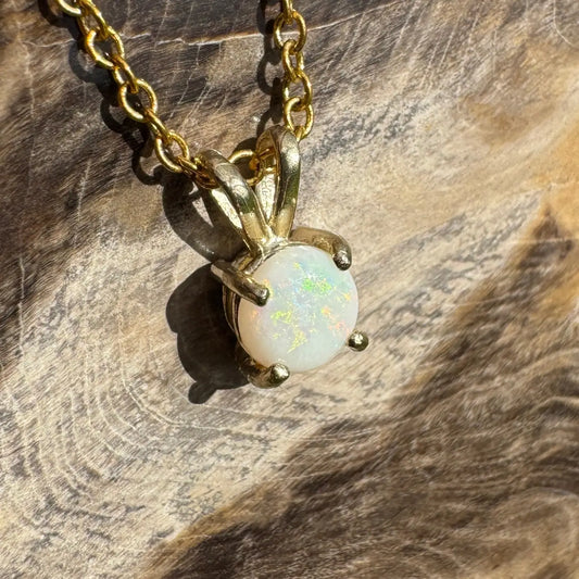 Gold chain necklace with handcrafted 9ct solid gold opal pendant showcasing Coober Pedy opal