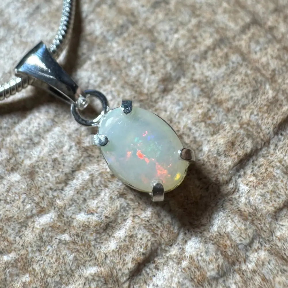 Opal pendant with silver setting from Sunset Reds handcrafted Coober Pedy opal necklace