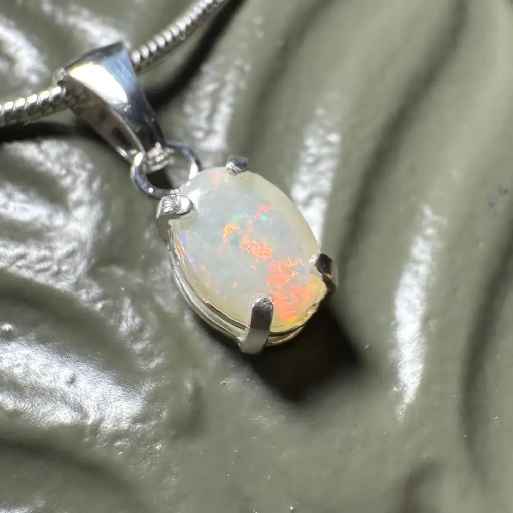 Opal pendant with silver setting from Sunset Reds handcrafted 0.7ct Coober Pedy Opal necklace