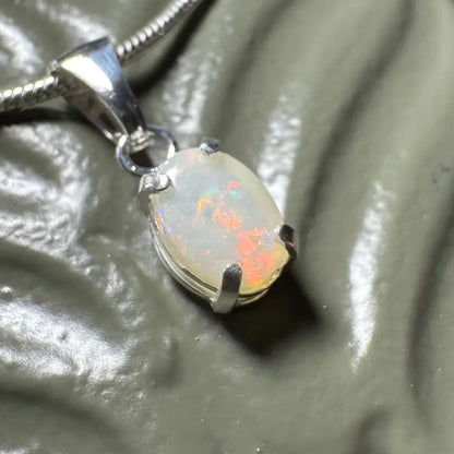 Opal pendant with silver setting from Sunset Reds handcrafted 0.7ct Coober Pedy Opal necklace