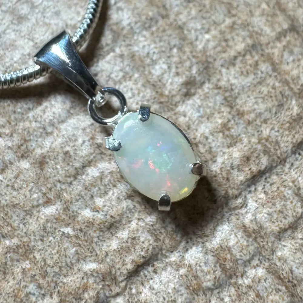 Oval opal pendant with silver setting from Sunset Reds handcrafted Coober Pedy opal necklace