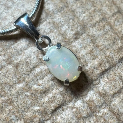 Oval opal pendant with silver setting from Sunset Reds handcrafted Coober Pedy opal necklace