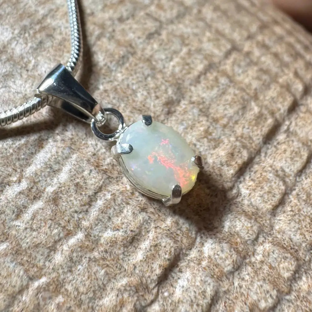 Opal pendant necklace showcasing a handcrafted 0.7ct Coober Pedy opal in sterling silver