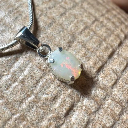Opal pendant necklace showcasing a handcrafted 0.7ct Coober Pedy opal in sterling silver