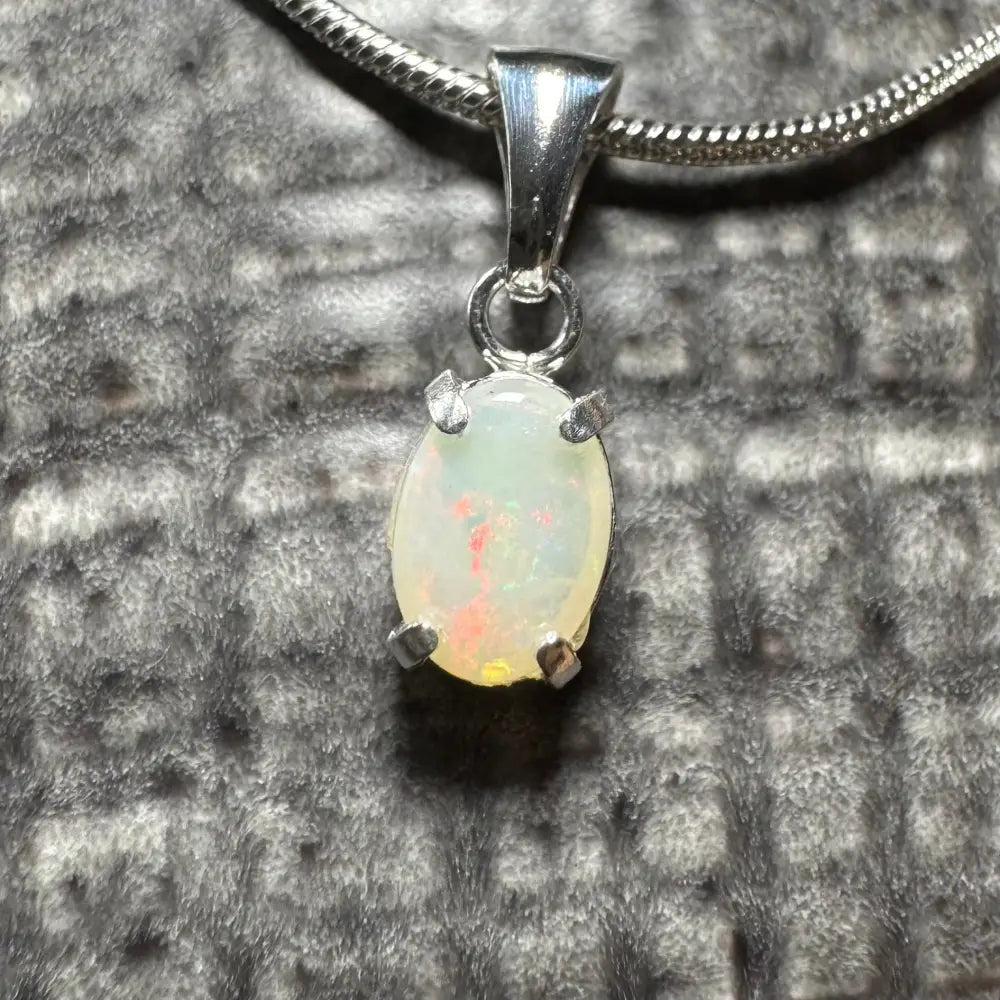 Opal pendant necklace featuring a 0.7ct Coober Pedy Opal in sterling silver from Sunset Reds