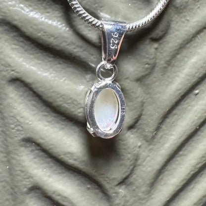 Silver pendant with oval white stone from Sunset Reds handcrafted Coober Pedy Opal necklace