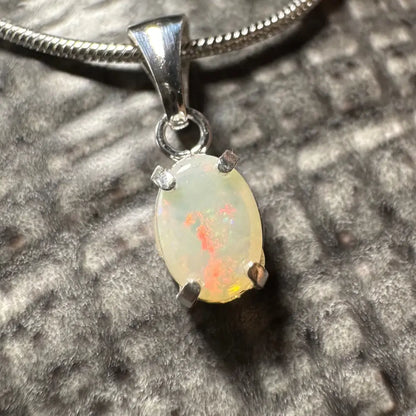 Oval opal pendant with silver setting from Sunset Reds handcrafted Coober Pedy opal necklace