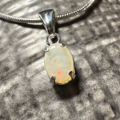 Opal pendant with silver chain from Sunset Reds handcrafted 0.7ct Coober Pedy Opal necklace