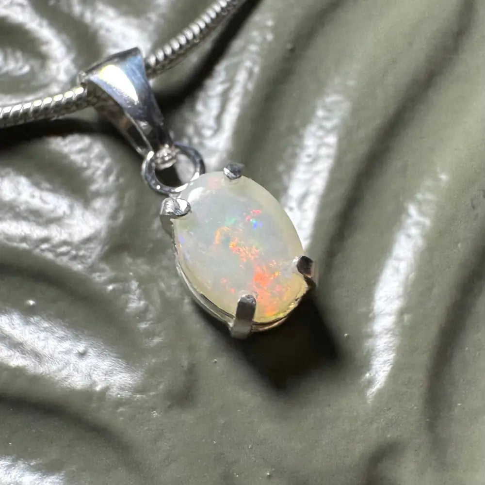 Sunset Reds handcrafted 0.7ct Coober Pedy Opal pendant with silver setting