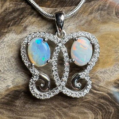Silver opal butterfly pendant featuring Coober Pedy and Lightning Ridge opals in necklace