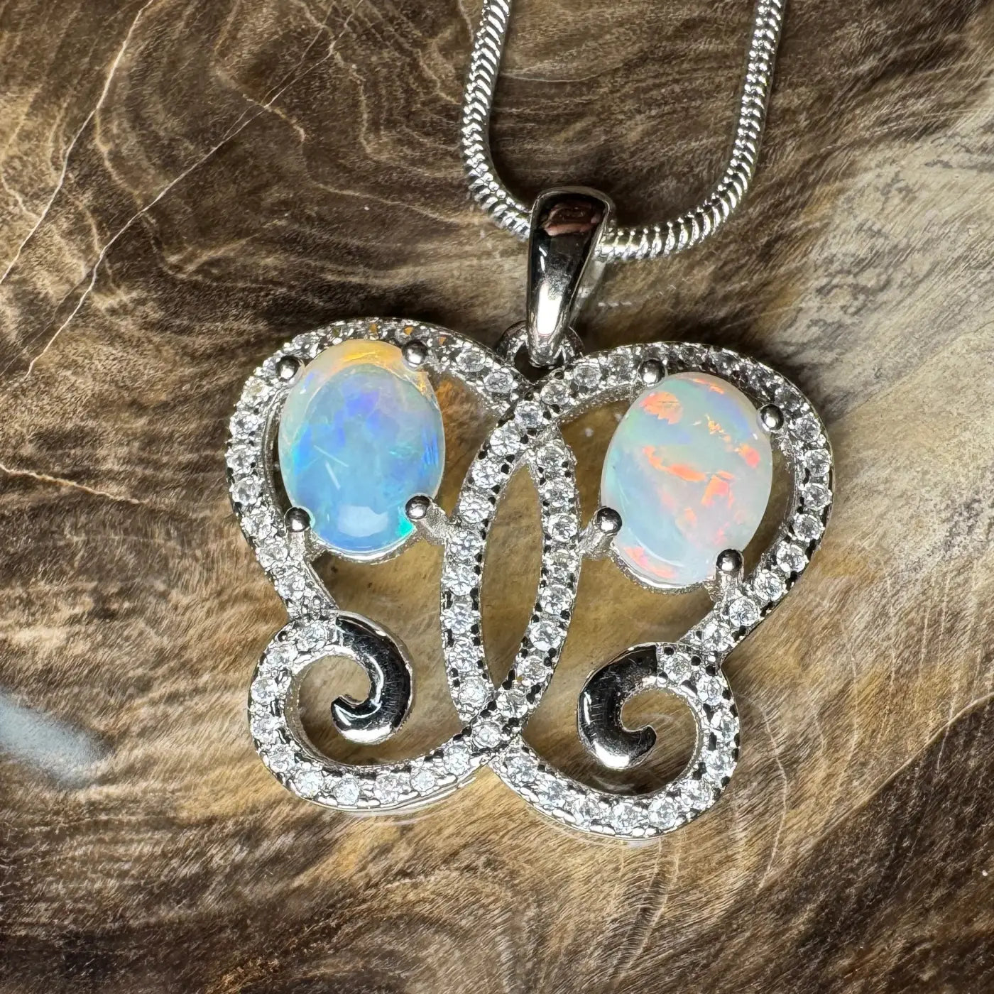 Silver butterfly pendant with Coober Pedy, Lightning Ridge opals and cubic zirconia