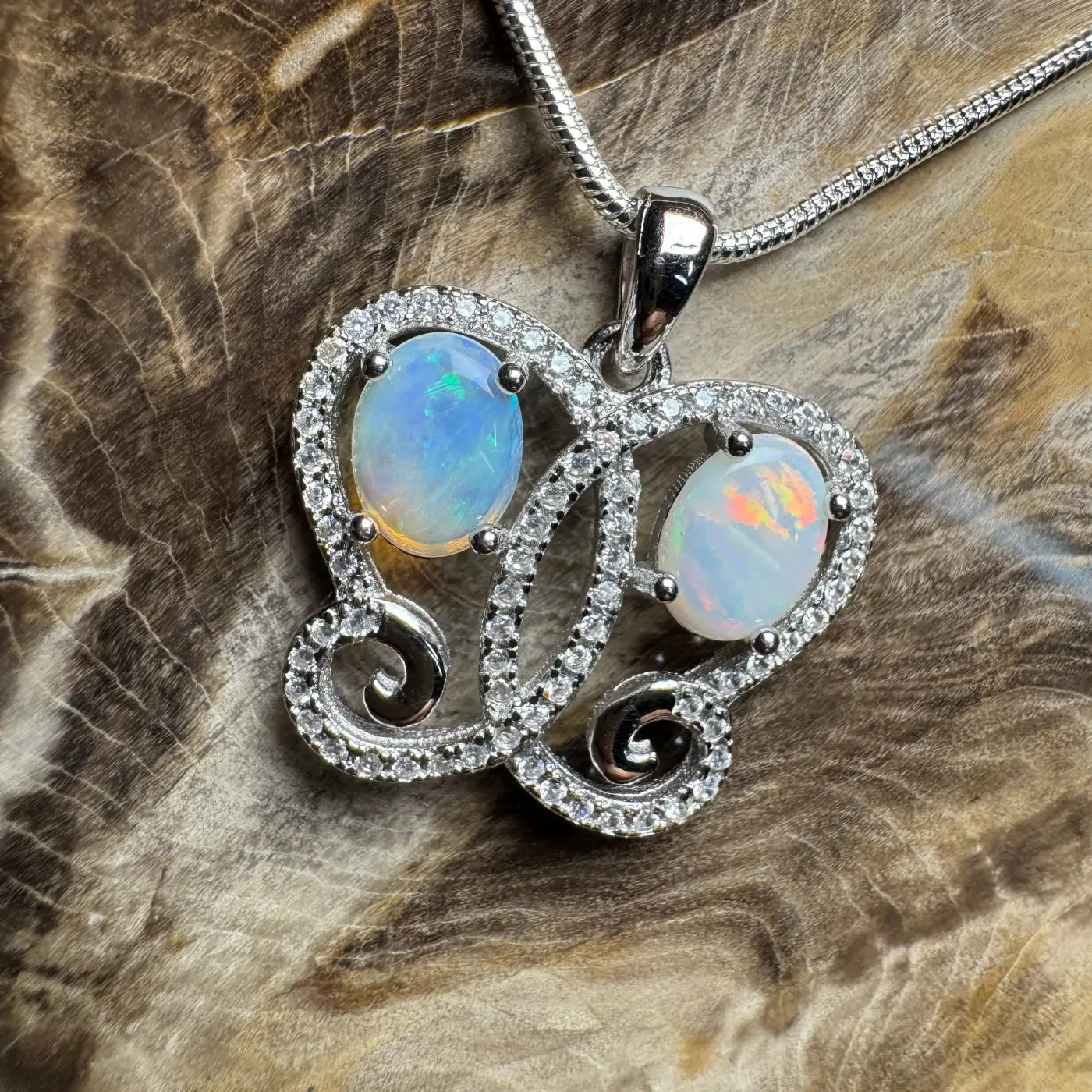 Silver opal pendant necklace featuring a handcrafted Coober Pedy Opal and Cubic Zirconia