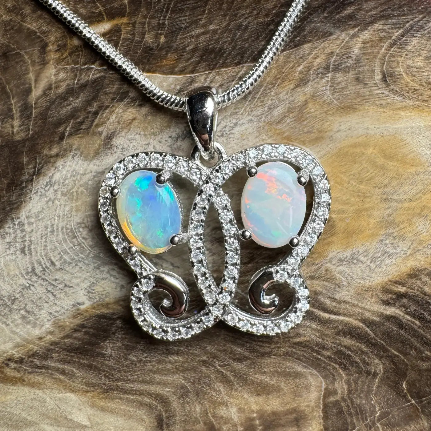 Silver opal butterfly pendant featuring Coober Pedy and Lightning Ridge opals
