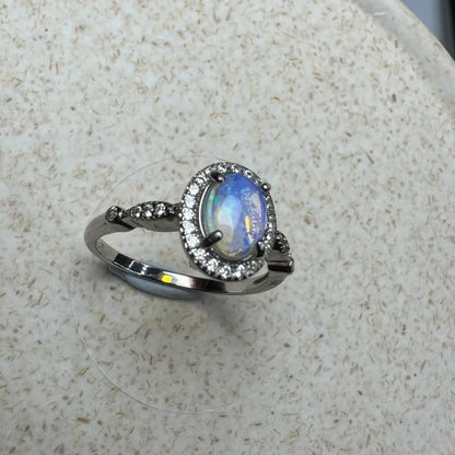 Silver ring with oval Lightning Ridge Opal and diamond halo in 925 Sterling Silver