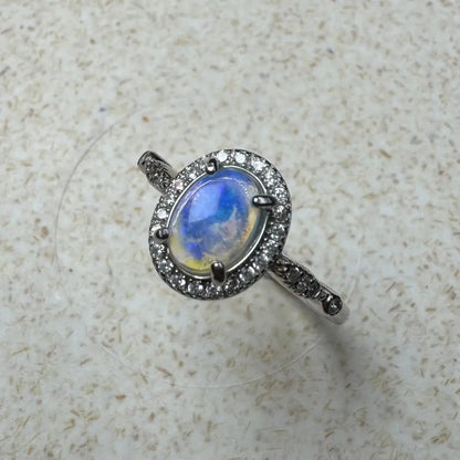 Oval moonstone ring with diamond halo in sterling silver from Wave Rock Grace collection