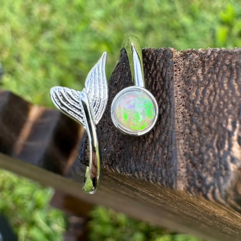 Silver mermaid tail ring with a 0.3ct Lightning Ridge opal in handcrafted sterling silver design