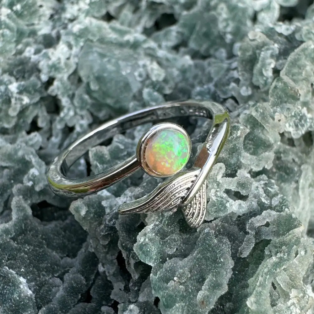 Silver ring with an opal and fish tail detail from Where the Ocean meets the Outback collection