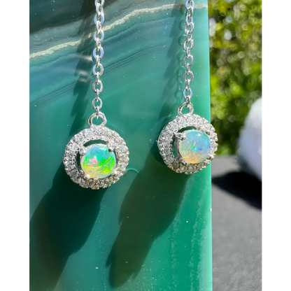 Handcrafted Whitsunday Sparkle earrings featuring 0.7ct Lightning Ridge Opal and diamond halo design