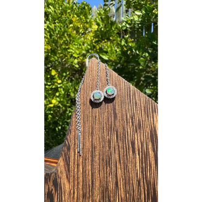 Silver opal halo earrings featuring a 0.7ct Lightning Ridge Opal and Cubic Zirconia accents